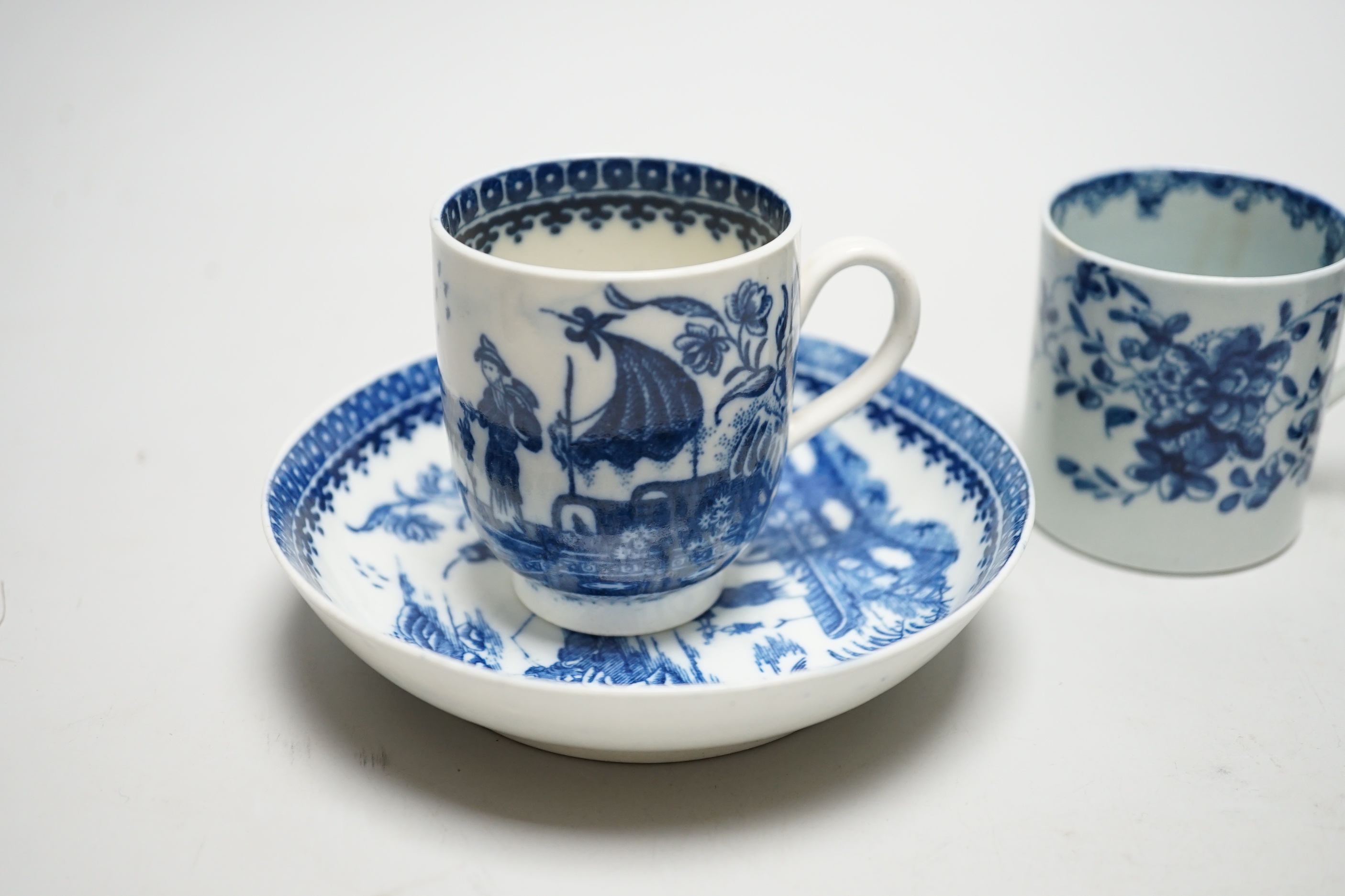 Two Worcester coffee cans, Mansfield and Three Flowers patterns, and a Worcester/Caughley coffee cup and saucer, Fisherman and Cormorant pattern